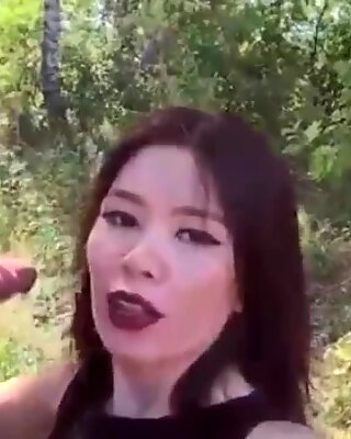 Asian girl loves from behind in the forest